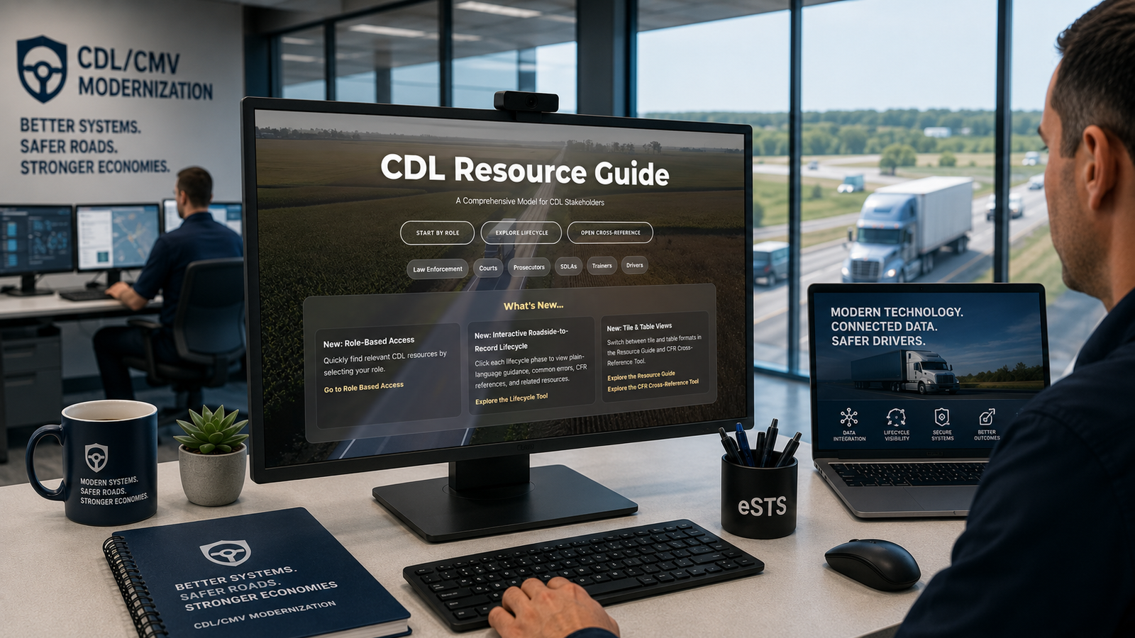CDL Resource Guide displayed in a modern transportation technology workspace overlooking commercial vehicle traffic